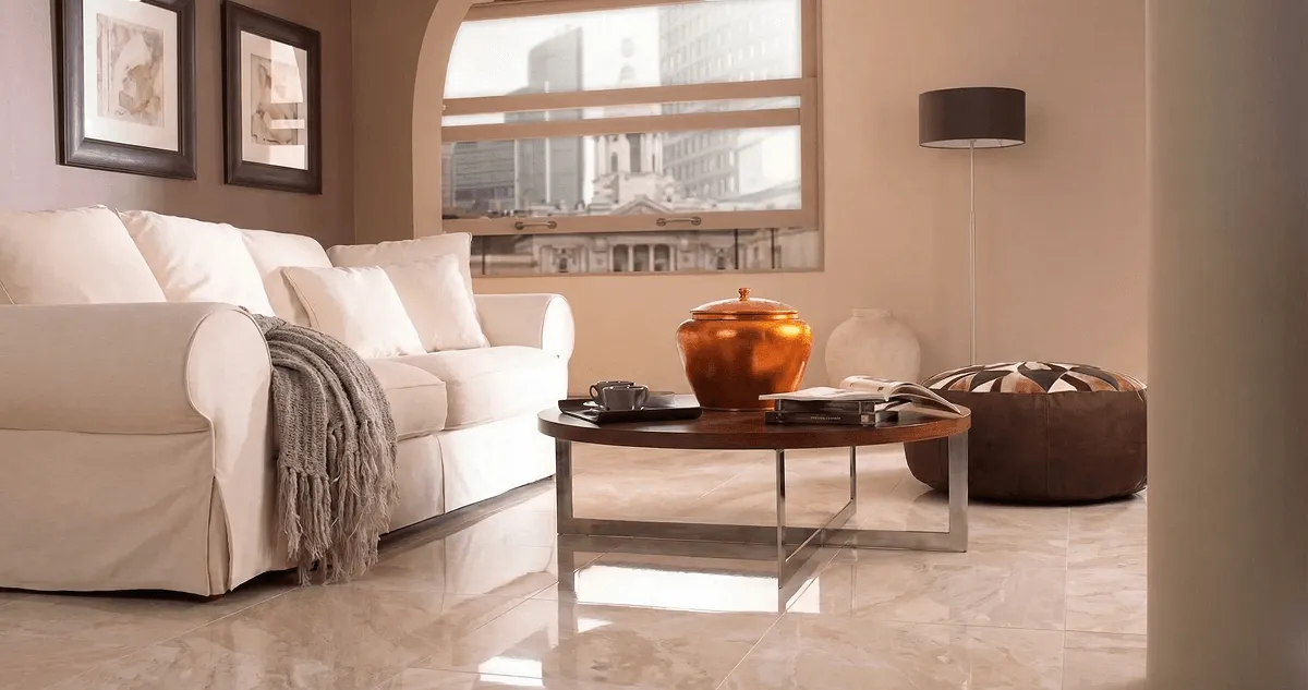 Modern living room with professionally installed marble flooring, a beige sofa, coffee table in Raleigh, NC