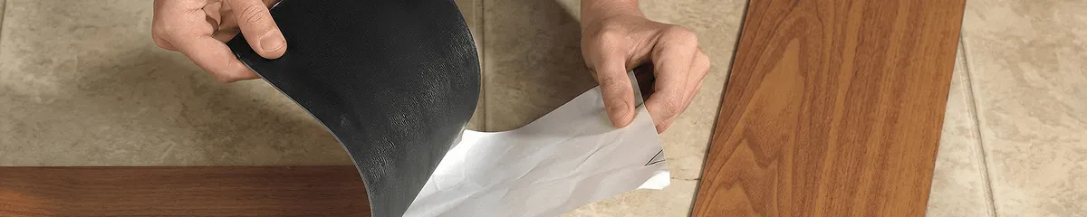A professional installing vinyl flooring in Raleigh, NC
